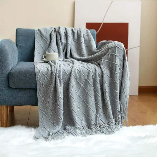 Knitted throw blankets with tassel